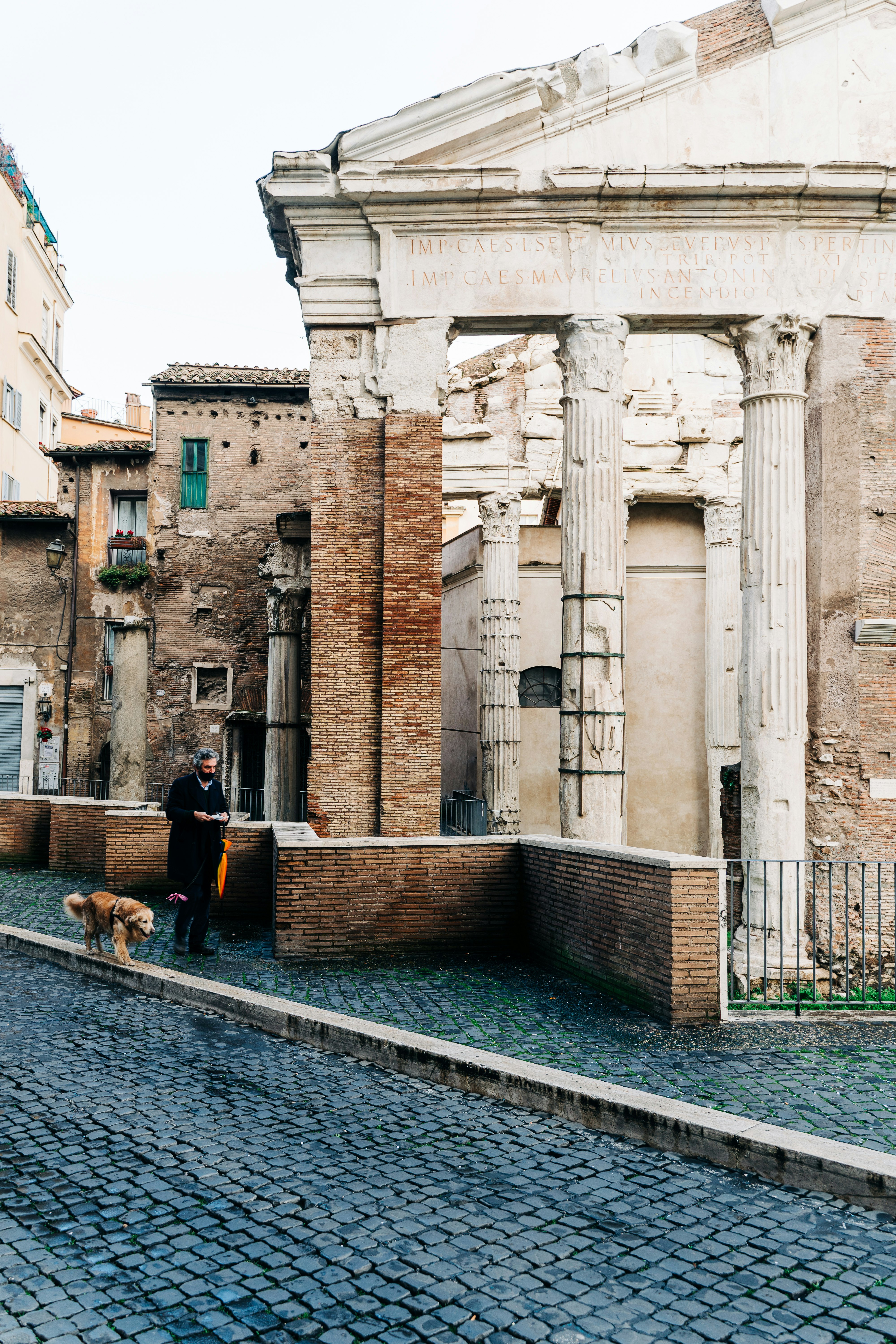 people sitting on bench near building during daytime